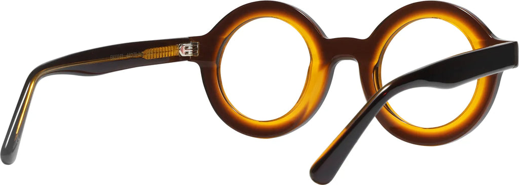 AMBÉRÉE three-quarter view — amber tortoiseshell round frames by J FRED LUXE